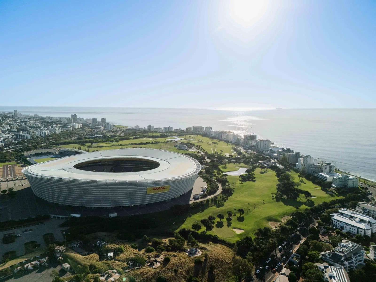 The stadium and the course along the seafront, under a bright sun