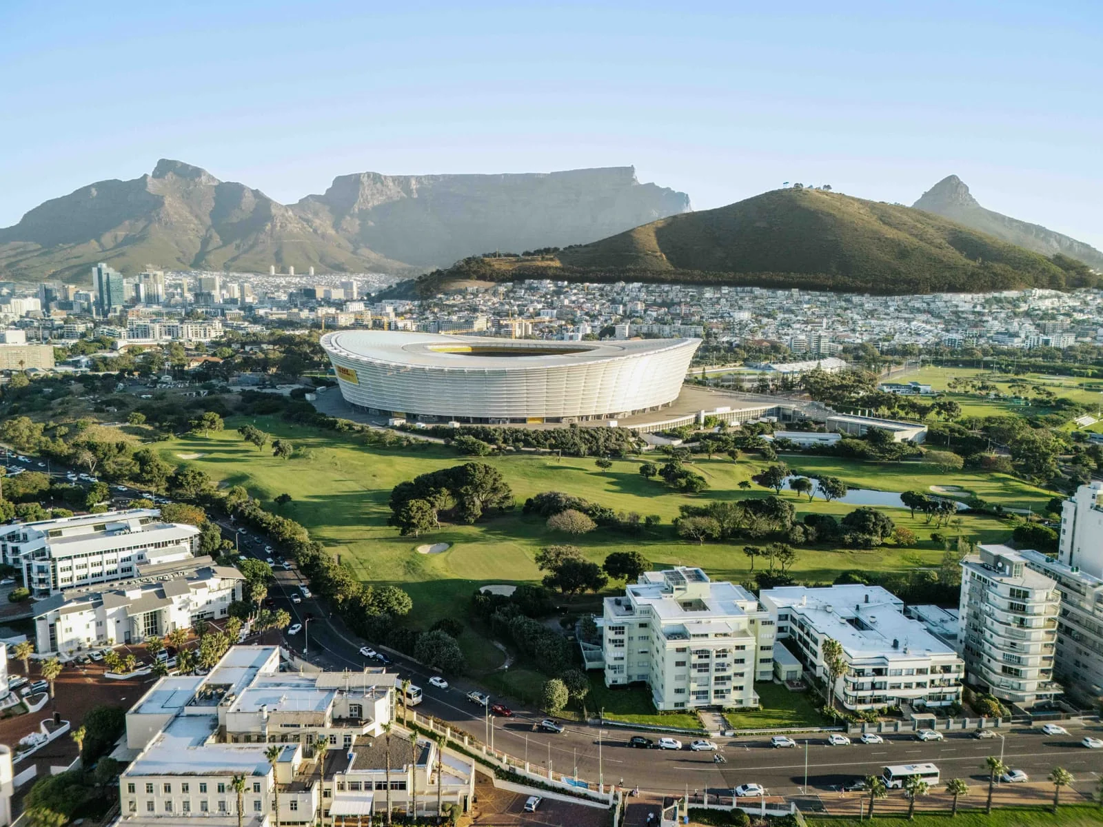 The stadium and the course from above the seafront, with Table Mountain behind